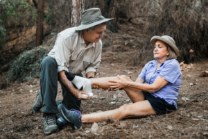 Hiker receiving urgent care for hiking injuries in Torrance after a summer trail accident