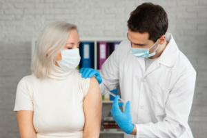 Adult receiving shingles vaccine at Life Saver Urgent Care in Torrance for summer protection